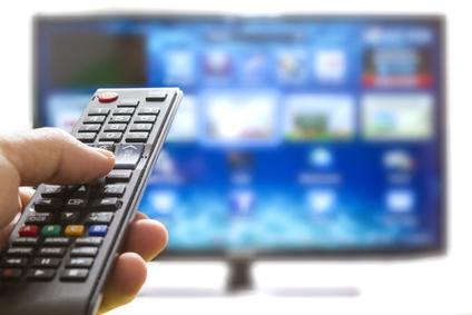Smart tv and hand pressing remote control